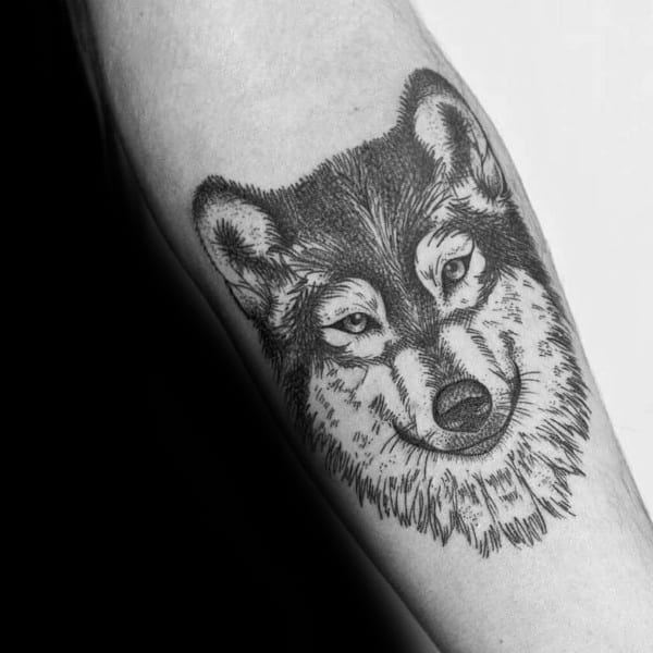 Fine-line Siberian Husky tattoo on a man's forearm, featuring intricate fur details and a gentle expression for a minimalist yet detailed design.