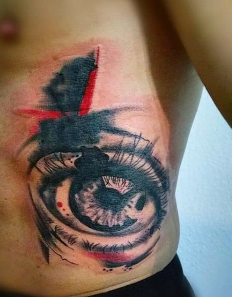 Male Side Ribs Black And Red Eye Tattoo
