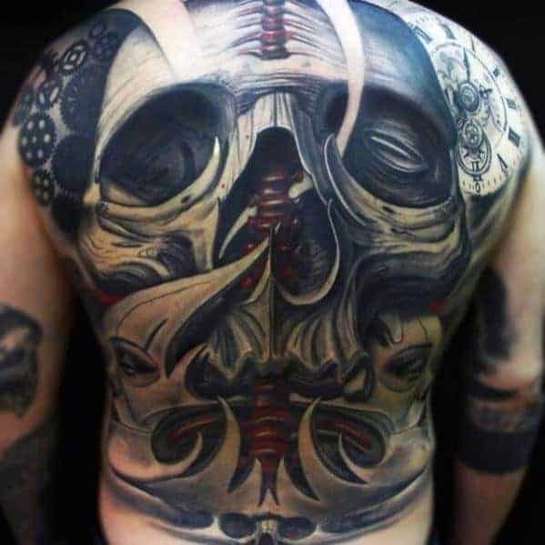 Back tattoo featuring a dark, intricate skull with abstract and mechanical elements
