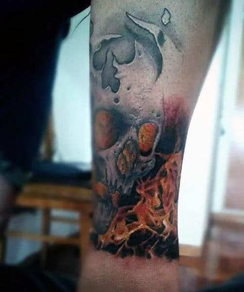 Male Skull Flames Tattoo On Wrist