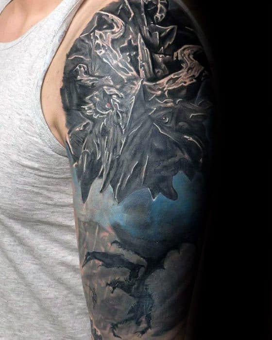Individual with a detailed dragon tattoo on their upper arm, reminiscent of Skyrim, in a gray tank top
