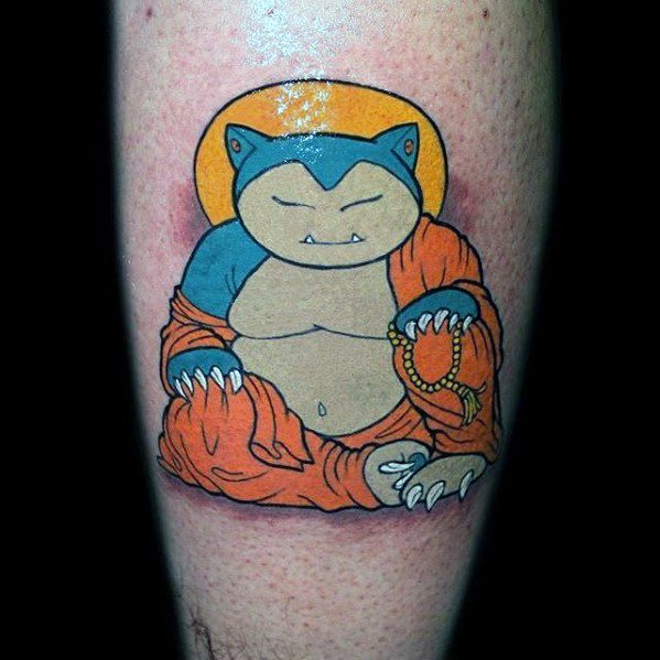 Snorlax tattoo on leg in peaceful Buddha pose, wearing orange robes with a golden halo and holding prayer beads.