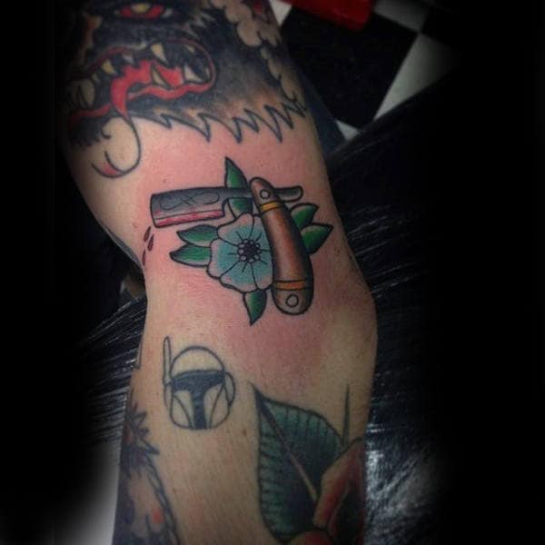 Male Straight Razor And Flower Tattoo On Forearms