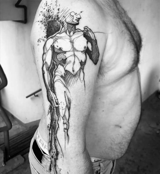 Abstract anatomical tattoo of a male figure on the upper arm, blending sketch-style lines with bold black shading and artistic splatter.