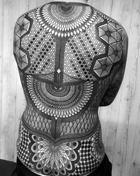 Large full-back tattoo featuring intricate geometric patterns, mandalas, and symmetrical dot work for a mesmerizing and detailed design.