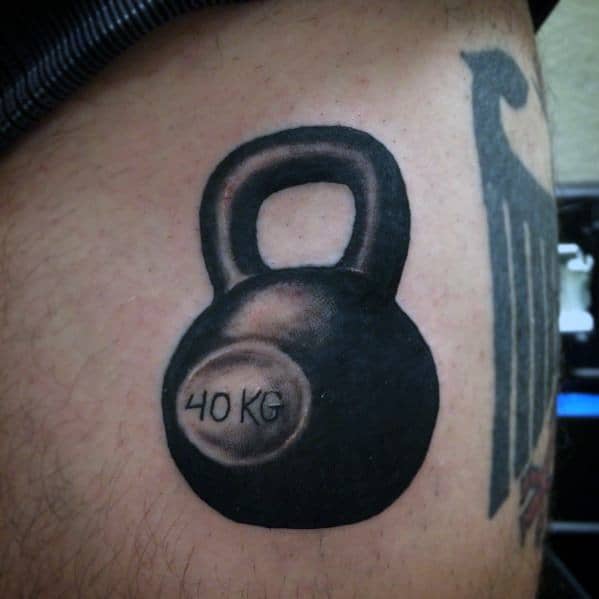 Realistic black and gray kettlebell tattoo with "40 KG" marking, symbolizing strength, endurance, and dedication to fitness and weightlifting.