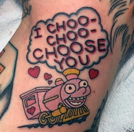 Colorful tattoo of the 'I Choo-Choo-Choose You' Valentine’s card from The Simpsons, featuring a smiling pink train and hearts.