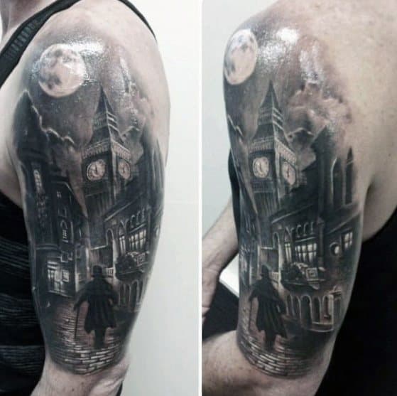 Detailed black and grey tattoo featuring Big Ben and a Victorian-style street scene with a figure walking under a moonlit sky, creating a dramatic and atmospheric effect on the upper arm.