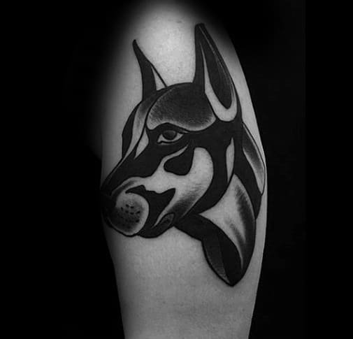 Bold blackwork Doberman tattoo with smooth gradients and abstract shapes, combining minimalism with strong visual impact.