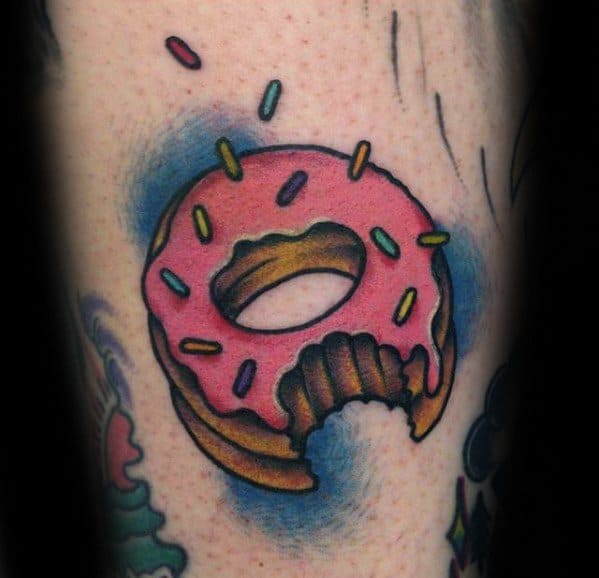 Tattoo of a bitten pink frosted donut with colorful sprinkles and a blue background glow, giving it a vibrant, dynamic look.