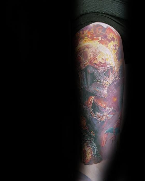 Highly detailed Ghost Rider arm tattoo with a glowing skull, fiery effects, and intricate motorcycle elements in a dramatic, realistic style.