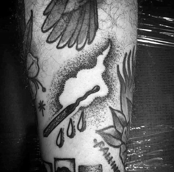 Black and grey tattoo of a burnt matchstick with smoke, dotwork shading, and dripping elements, symbolizing burnout, emotion, or inner struggle.