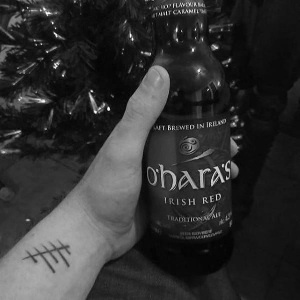 Male Tattoo With Ogham Design Wrist