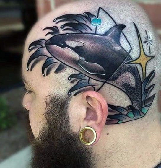Vibrant tattoo on the side of the head, featuring an orca whale leaping out of the water, with abstract geometric shapes and stars adding a modern, artistic touch.