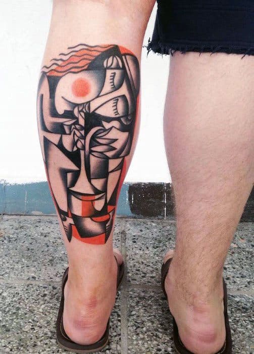 Colorful calf tattoo inspired by Picasso’s cubist style, featuring a woman with flowing red hair, abstract forms, and bold geometric shading.