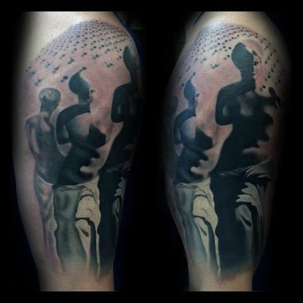 Surreal Salvador Dali-inspired tattoo depicting distorted classical statues and shadow figures dissolving into a pattern of floating forms.