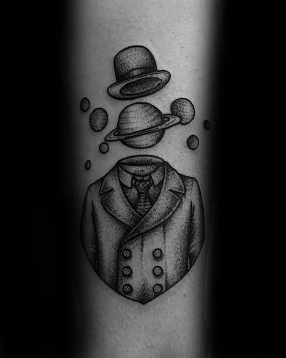 Surreal Saturn tattoo design for men with a dotted suit, floating planet as a head, and bowler hat above in a cosmic gentleman style.