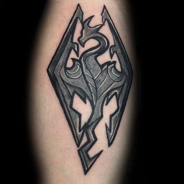 Tattoo of a dragon in a geometric style, echoing the Skyrim logo