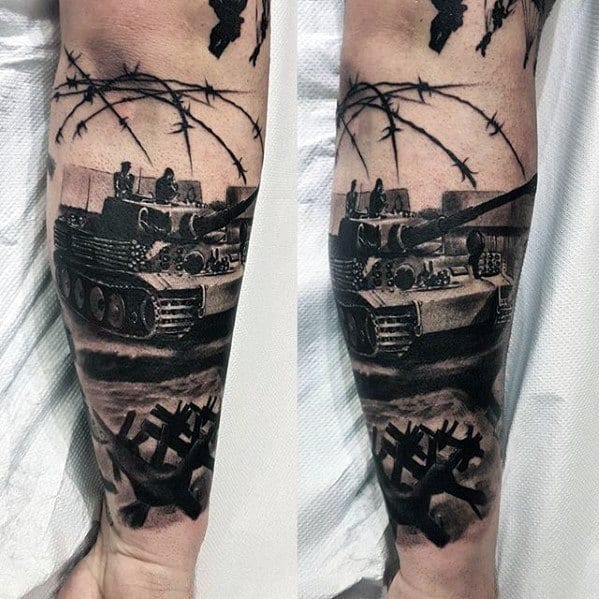 Realistic black and grey forearm tattoo of a WWII tank with soldiers, barbed wire, and anti-tank obstacles for a warzone effect.