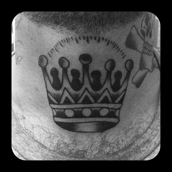 Bold black crown tattoo on the back of the neck featuring stylized dots, geometric shapes, and solid shading.