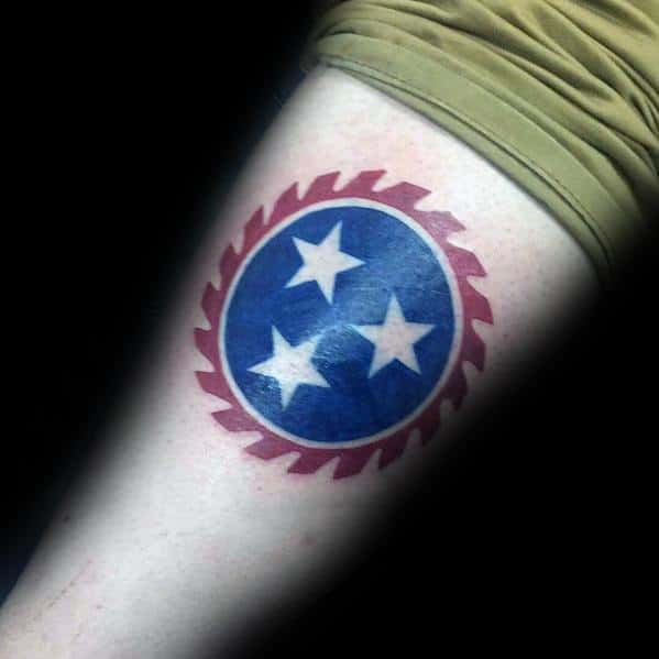 Tennessee three-star emblem tattoo with a bold saw blade border, blending state pride with a rugged, industrial-inspired design.