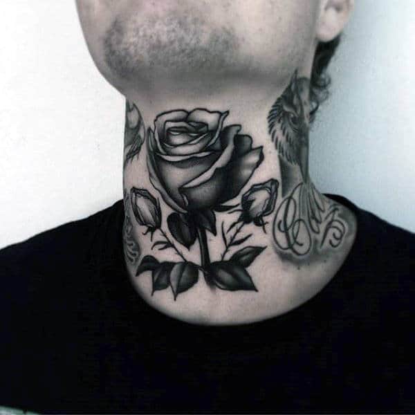 Throat tattoo featuring a detailed black and gray rose with shaded petals and leaves, creating a bold yet elegant floral design