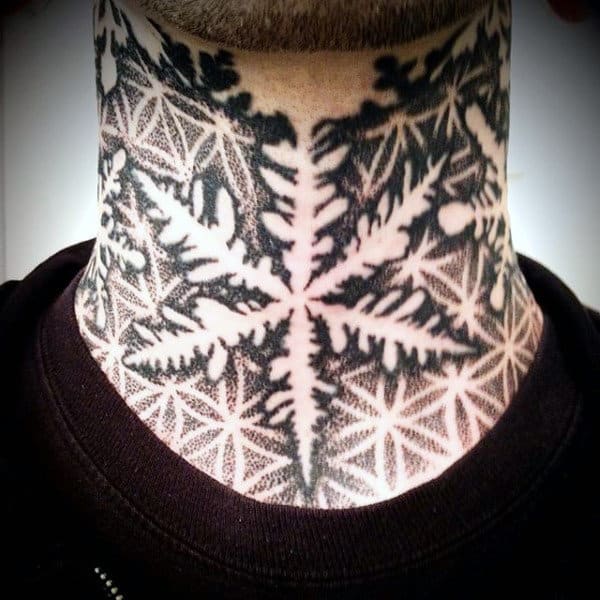 Throat tattoo featuring a bold black and white geometric snowflake design, intricately detailed with negative space and shading