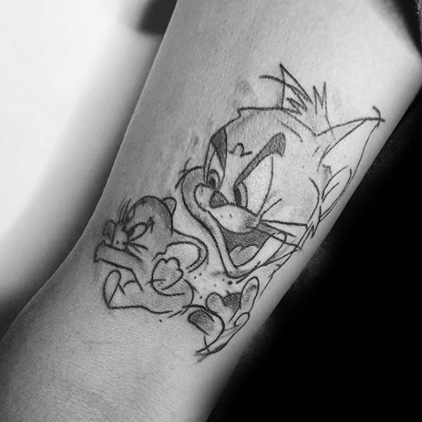 Sketch-style black line tattoo of Tom chasing Jerry, capturing dynamic motion and classic cartoon expressions.