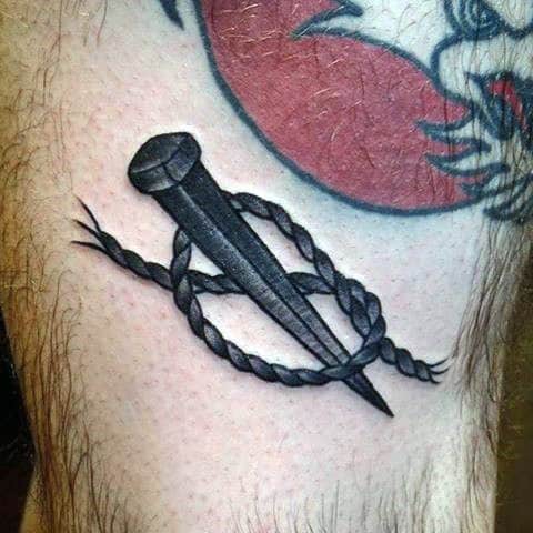 Male Torso Sharp Nail And Rope Tattoo