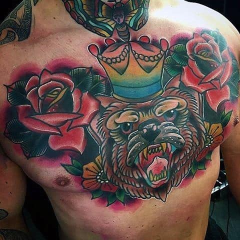 Colorful chest tattoo of a crowned roaring bear surrounded by vibrant red roses and green leaves in bold traditional style.