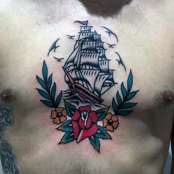 Male Traditional Flower Sailing Ship Tattoo On Upper Chest