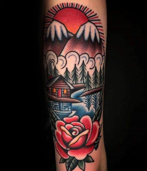 Traditional style tattoo of a mountain cabin by a river, with snowy peaks, pine trees, a red sunrise, and a bold rose in the foreground.