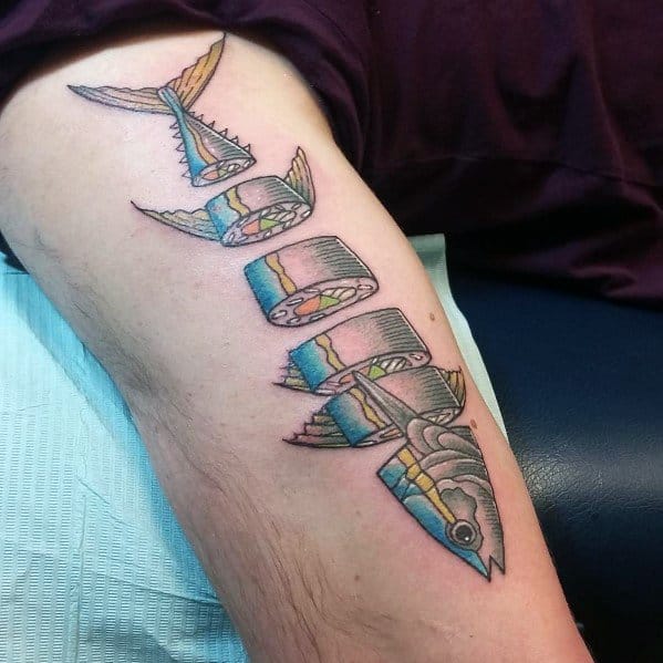 Creative tuna sushi roll tattoo on a man's leg, featuring a fish transforming into sushi pieces with vibrant colors and bold outlines.