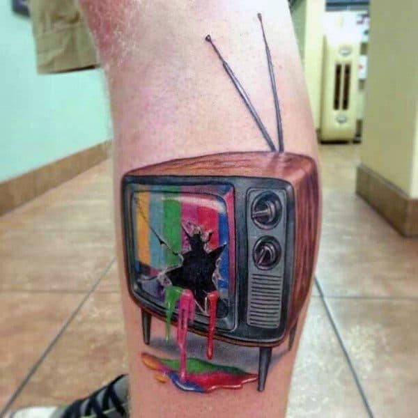 Realistic tattoo of a vintage TV with a shattered screen, leaking vibrant rainbow colors onto the skin, with detailed wood grain and classic dials.