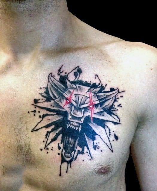 Striking Witcher chest tattoo of the wolf medallion with red claw marks and bold black ink splatter for a dynamic, fierce look.