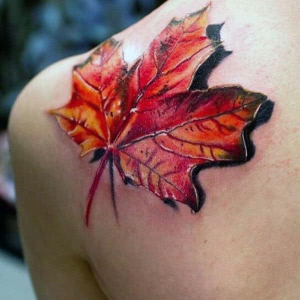 Male With 3d Orange Leaf Fall Upper Back Shoulder Tattoo