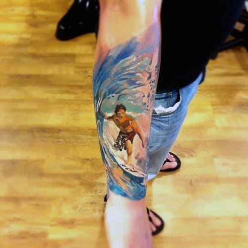 Male With Artistic Watercolor Tattoo Of Surfing On Forearms