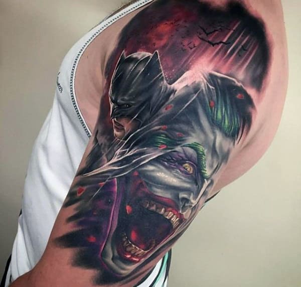 Male With Batman Joker Tattoo On Upper Arm