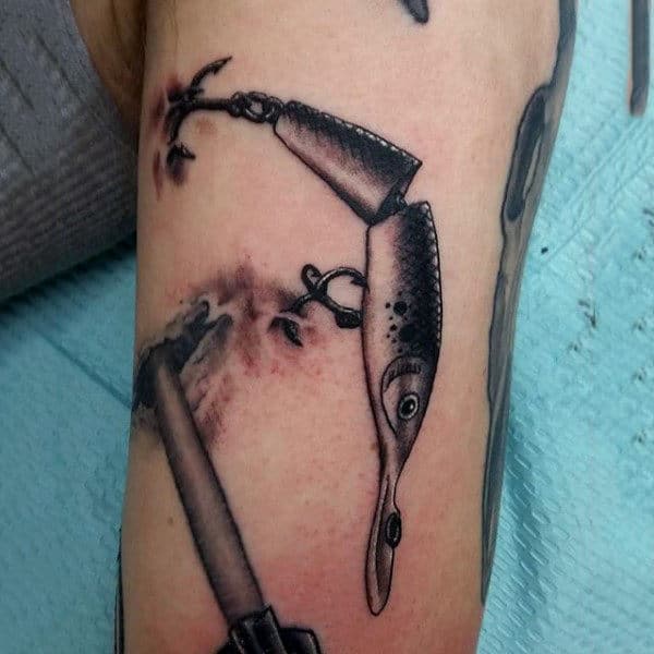 Male With Black Shaded Fish Hook Tattoo Inspiration