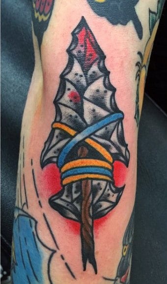 Male With Brilliant Arrowhead Tattoo On Forearms
