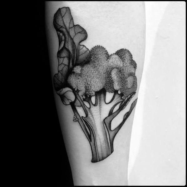 Black and gray broccoli tattoo on the forearm, featuring intricate dot work and fine shading for a detailed and realistic design.