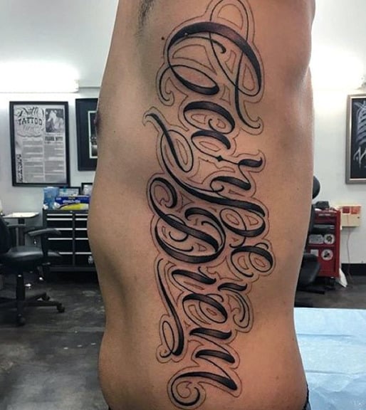 Male With Carpe Diem Rib Tattoo