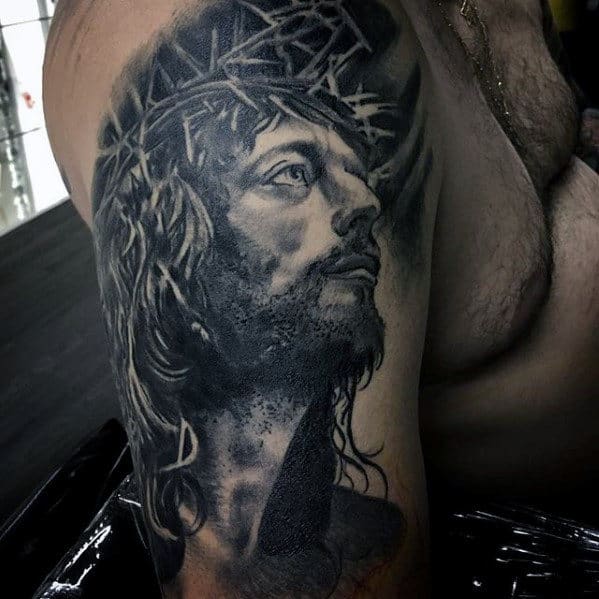 Male With Catholic Jesus Arm Tattoo