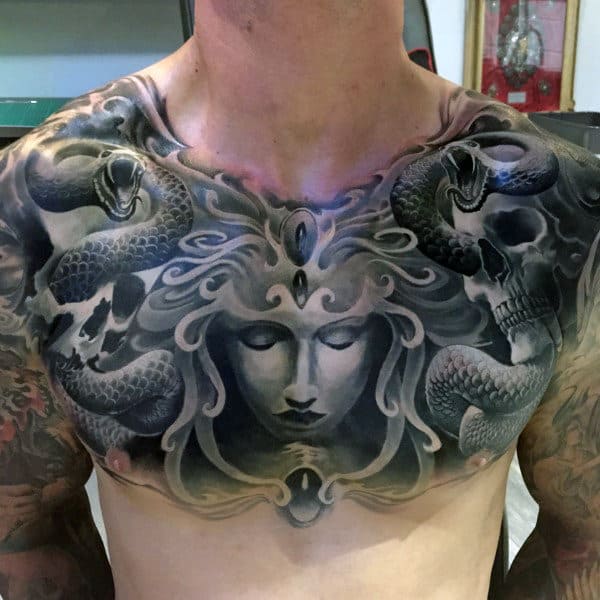 Male With Chest Snake And Female Portrait Tattoo