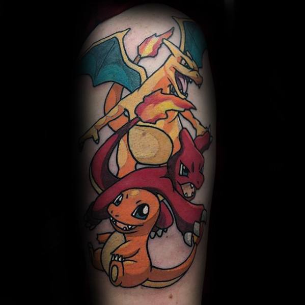 Vertical tattoo of Charmander, Charmeleon, and Charizard stacked in evolution order with bold outlines and fiery expressions on upper arm.