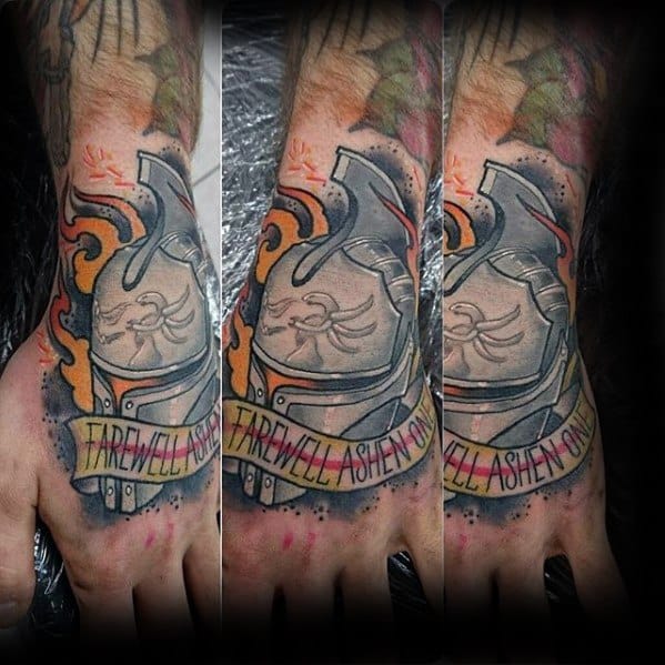Dark Souls hand tattoo with a knight helmet, flames, and a banner reading "Farewell Ashen One" in bold red letters.