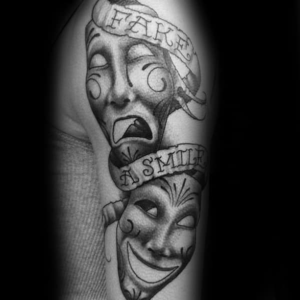 Male With Cool Drama Mask Tattoo Design Fake A Smilie On Arm