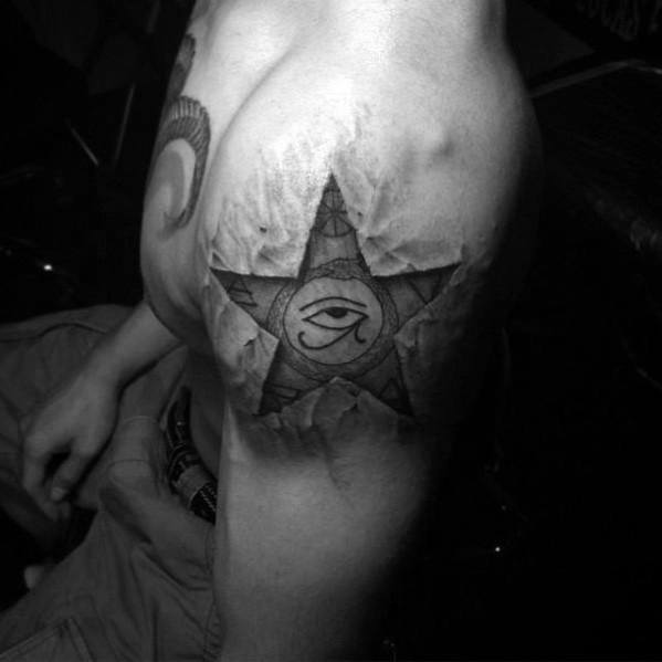 3D star tattoo on shoulder with torn skin illusion, featuring the Eye of Providence at the center for a mystical and symbolic look.