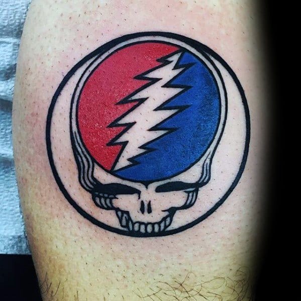 Classic Grateful Dead Steal Your Face skull tattoo with bold black outline and split red and blue lightning bolt design.