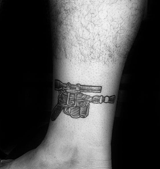 Male With Cool Han Solo Blaster Pistol Lower Leg Tattoo Design